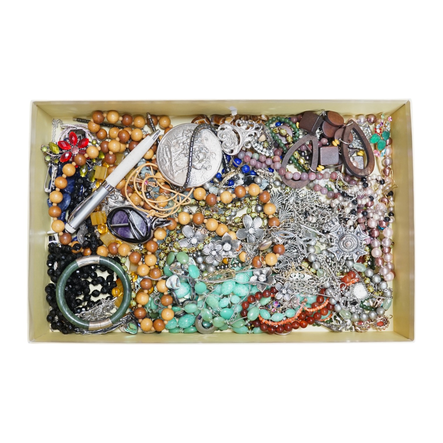 A quantity of assorted costume jewellery. Condition - poor to fair to good